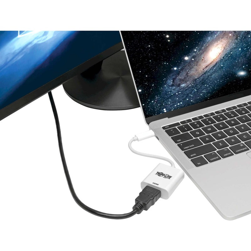 Tripp Lite adapter connecting a laptop to an external display showing desktop content