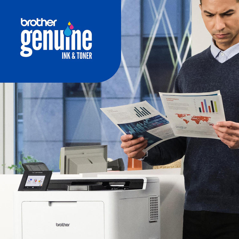 Business professional reviewing printed documents next to Brother printer