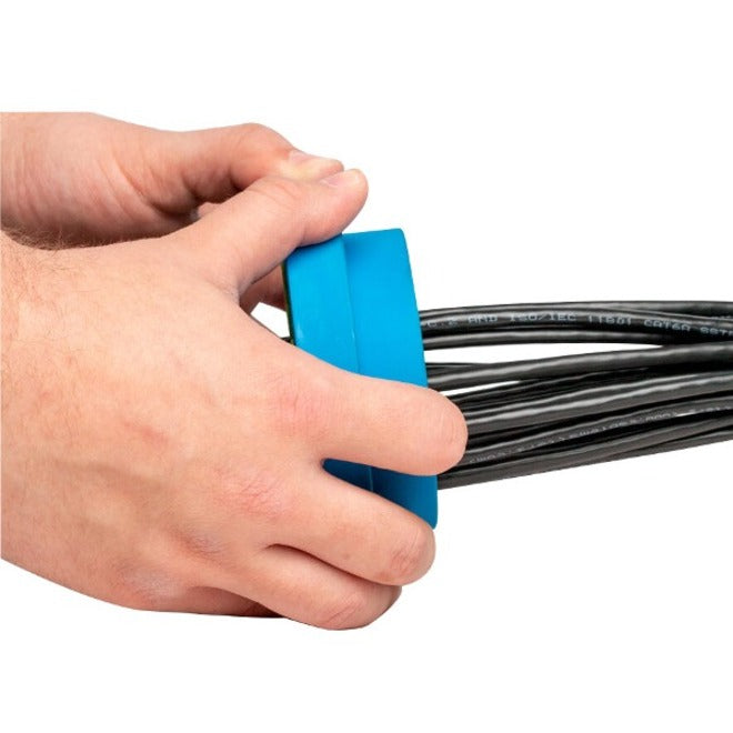 Hands demonstrating cable insertion into the Cable Comb