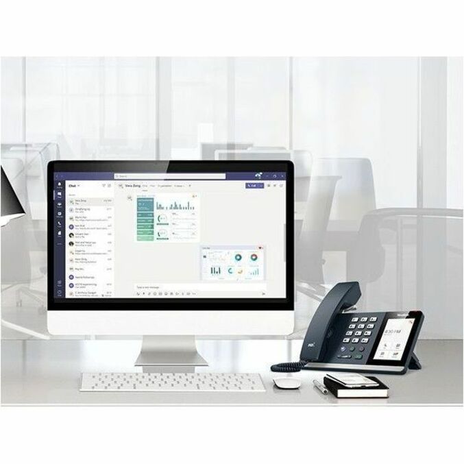 Yealink MP54-Zoom IP phone shown alongside desktop computer running Zoom interface