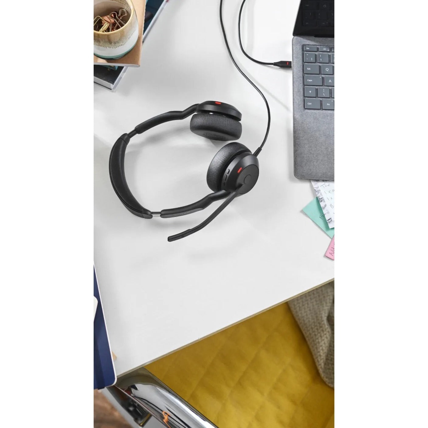 Jabra Evolve2 50 headset on desk next to laptop showing clean design-alternate-image8