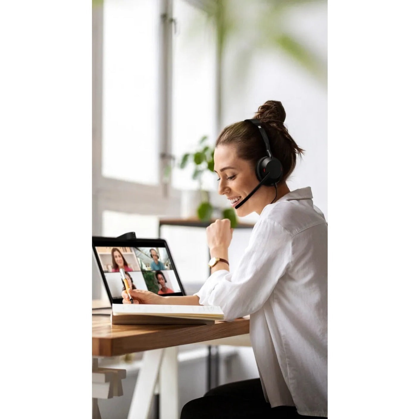 Woman participating in video conference wearing Jabra Evolve2 50 headset-alternate-image7