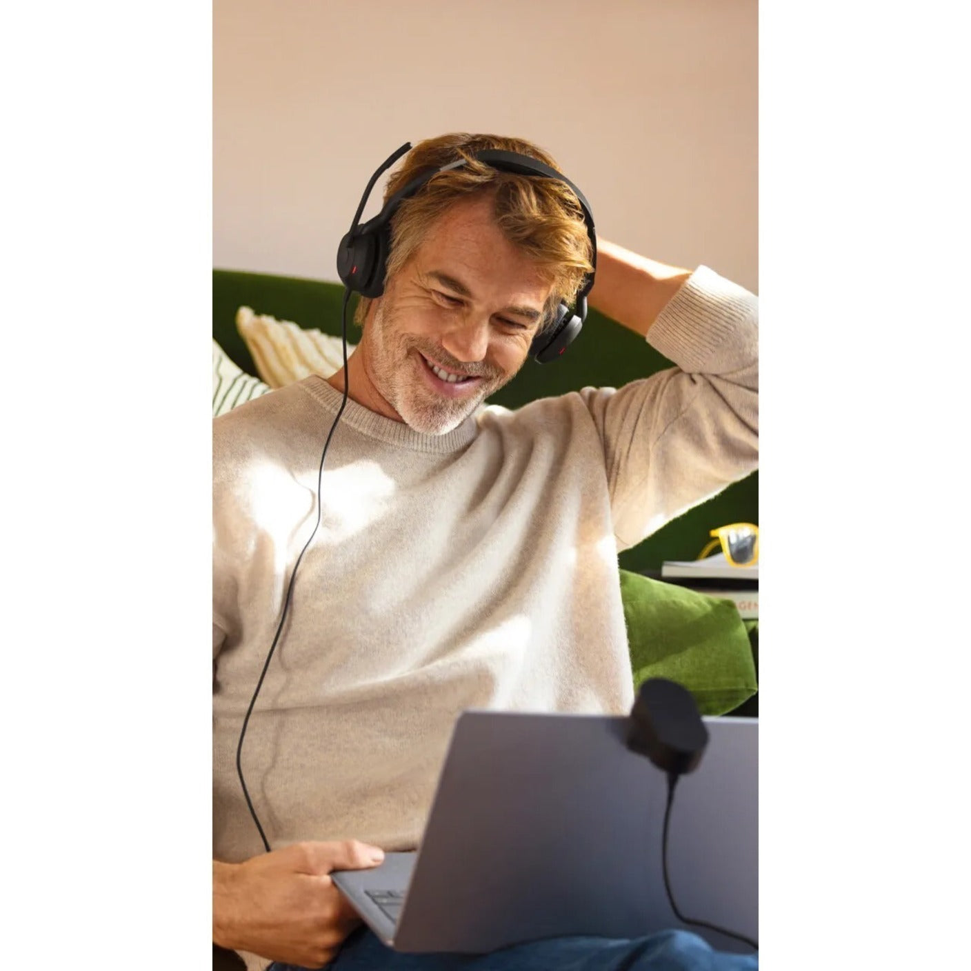 Person using Jabra Evolve2 50 during a remote work session with laptop-alternate-image5