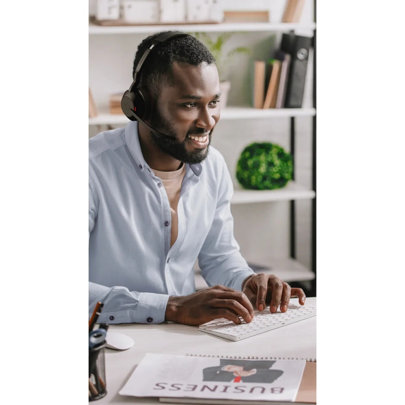 Professional using Jabra Evolve2 55 headset in modern office setting-alternate-image5