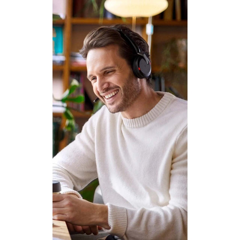 Person engaged in conversation wearing Jabra Evolve2 65 Flex