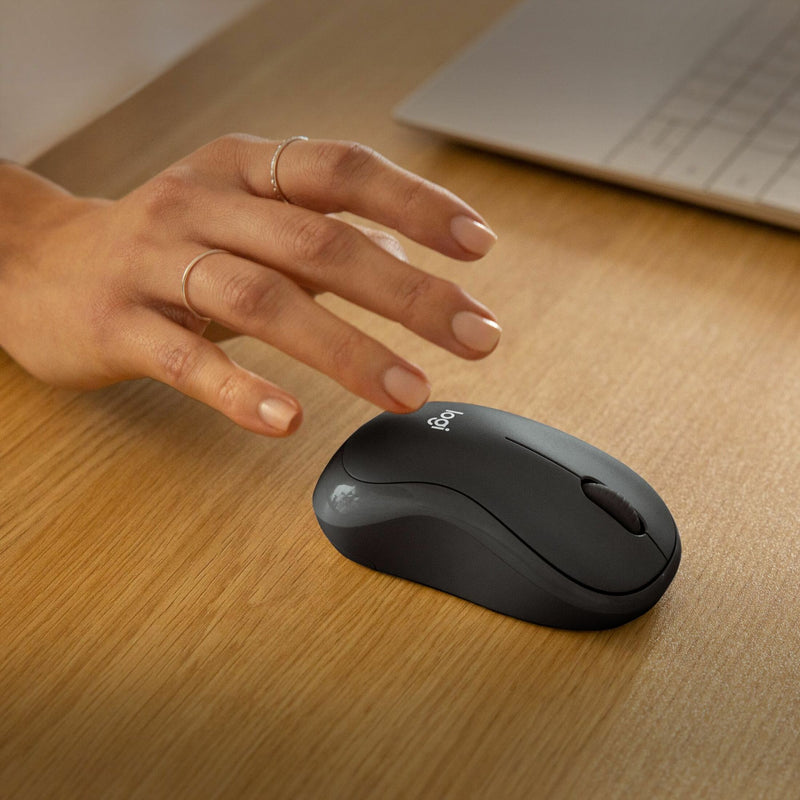 Close-up view of hand clicking Logitech M240 Silent mouse demonstrating quiet operation