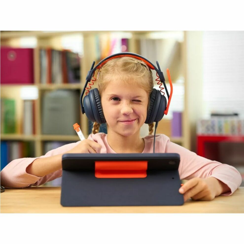 Student focusing on tablet work with Logitech Zone Learn headset-alternate-image11