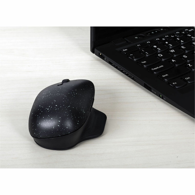 Targus ErgoFlip Mouse next to laptop keyboard showing wireless functionality