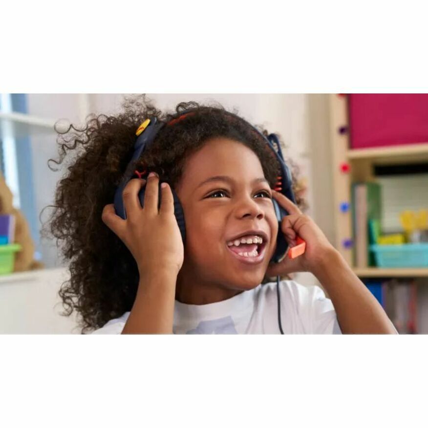 Student smiling while using Logitech Zone Learn headset in classroom-alternate-image7