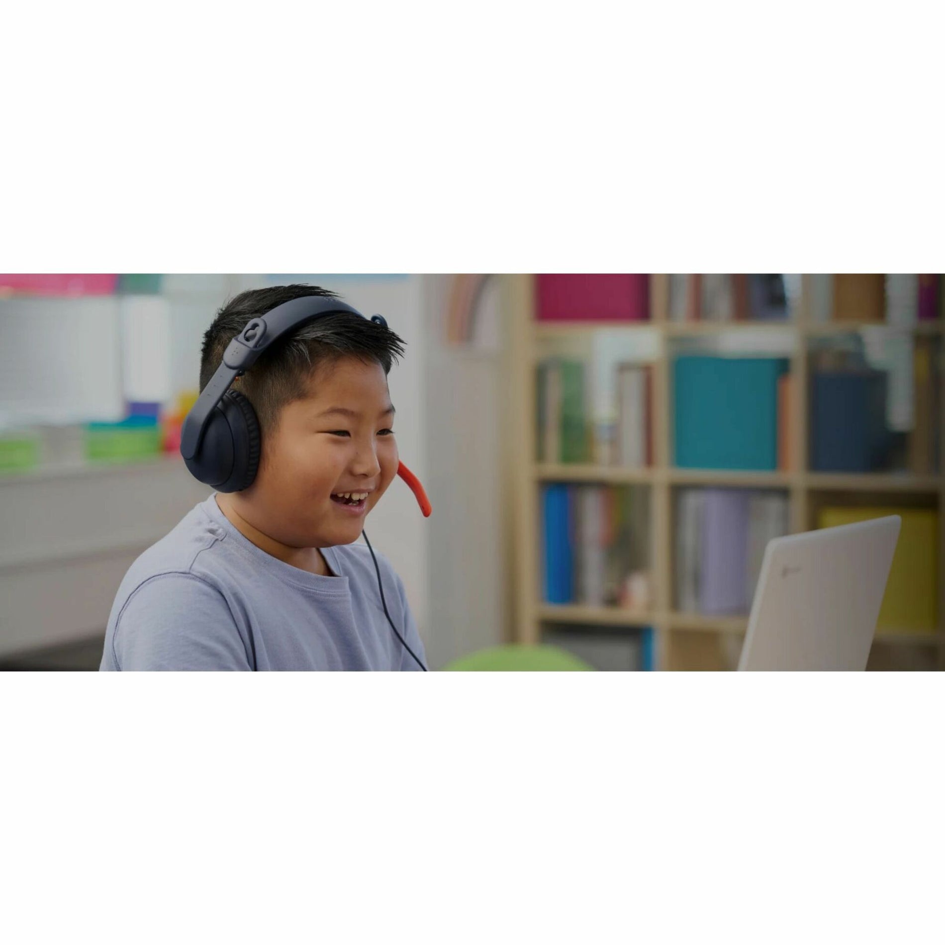 Student enjoying educational content with Logitech Zone Learn headset-alternate-image5