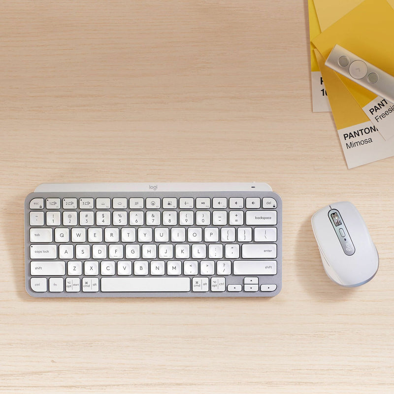 MX Anywhere 3S mouse alongside Logitech keyboard on desk