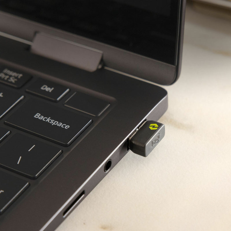 Close-up of Logi Bolt receiver inserted into laptop USB port