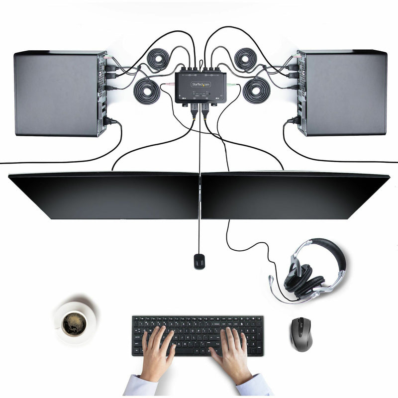 Complete setup view of StarTech.com KVM switch showing dual monitors, computers, and peripherals in a workspace environment