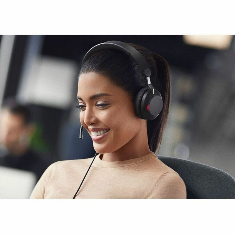 Person wearing Jabra Evolve2 40 SE headset in office environment