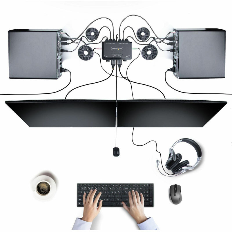 Complete workstation setup showing StarTech.com KVM switch connecting multiple devices and displays