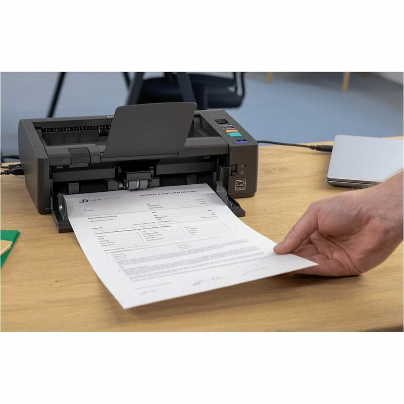 Canon DR-M140II in use in office environment