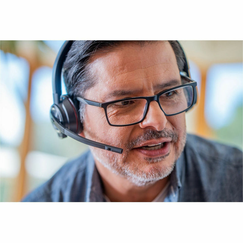 Professional wearing Poly Savi 8220 headset during video conference