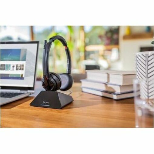 Poly Savi 8220 UC headset and base station on office desk with laptop-alternate-image6