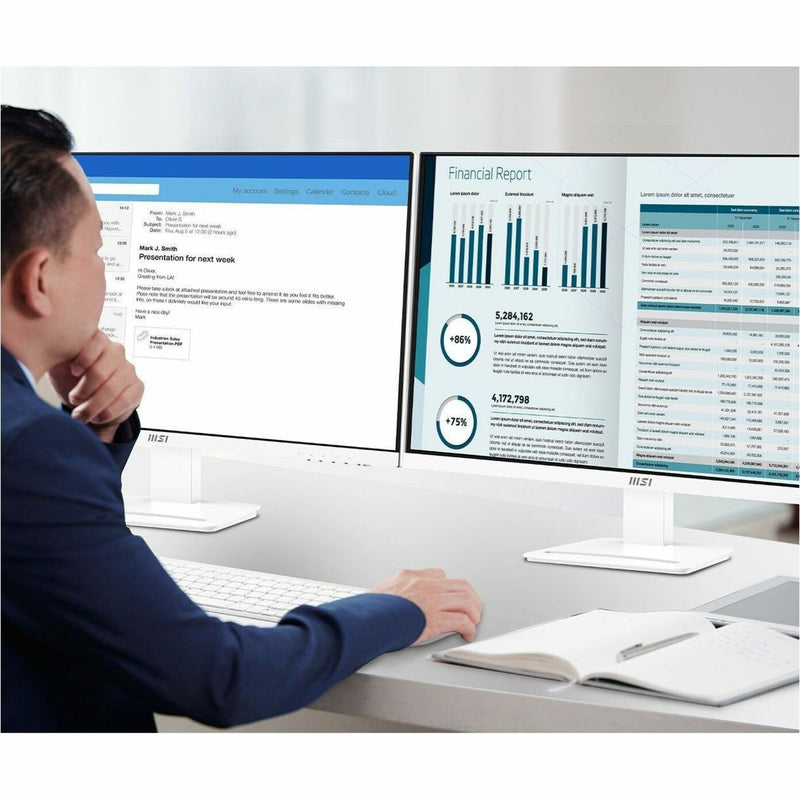 Professional using dual MSI ProMP273AW monitors for data analysis