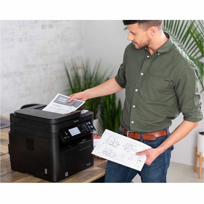 Professional using Canon printer with 070 toner cartridge for document printing