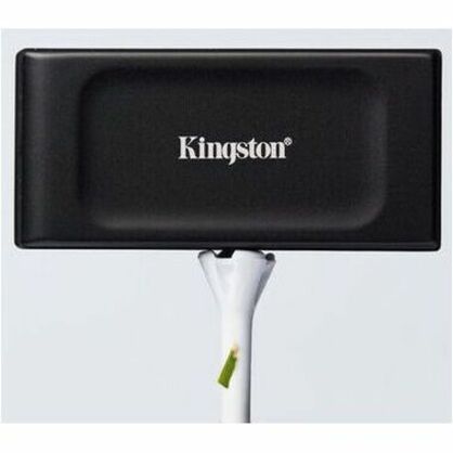 Artistic shot of Kingston XS1000 External SSD on white background