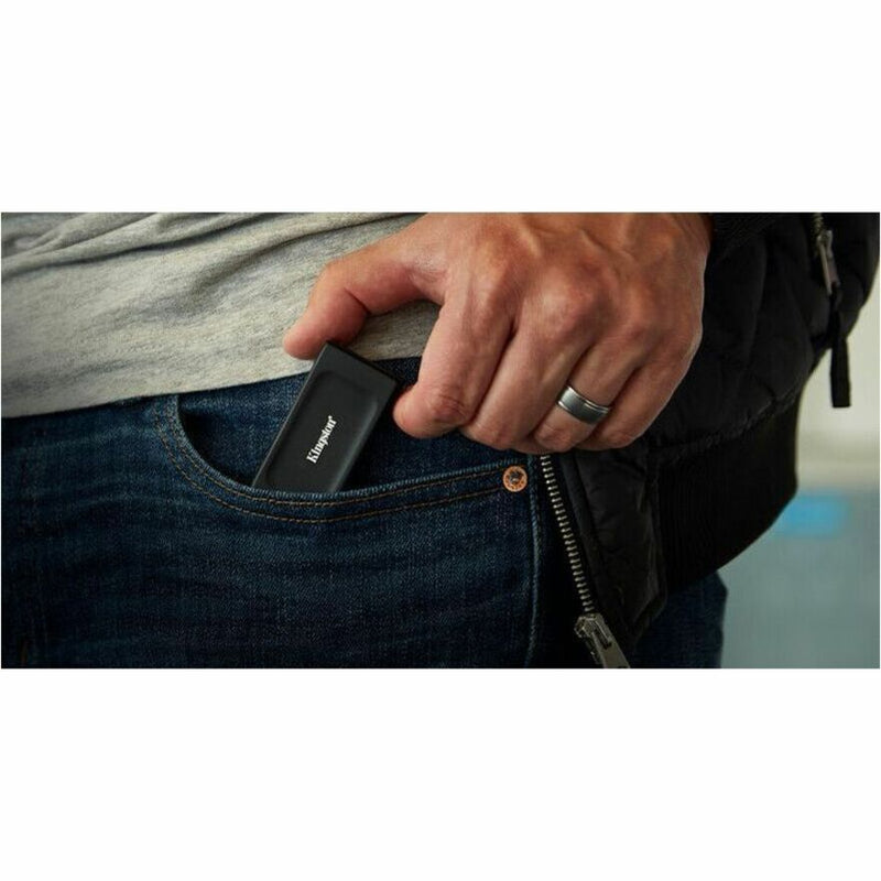 Kingston XS1000 External SSD being placed in jeans pocket