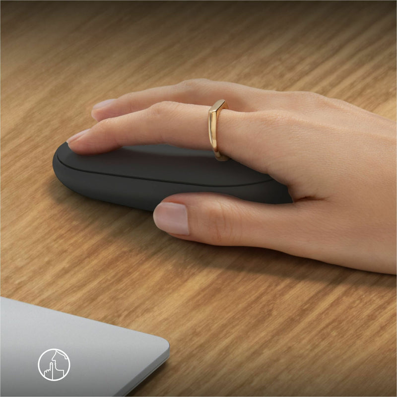 Close-up of hand using Logitech Pebble 2 M350s mouse showing ergonomic design