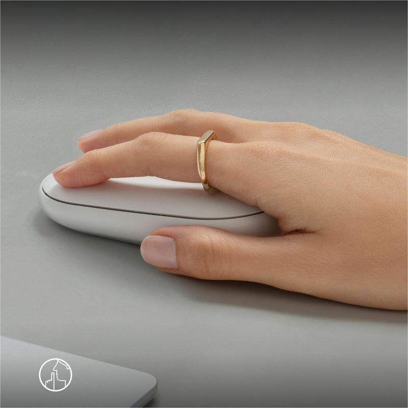 Close-up of hand using the Logitech Pebble 2 M350s mouse, showcasing its ergonomic design