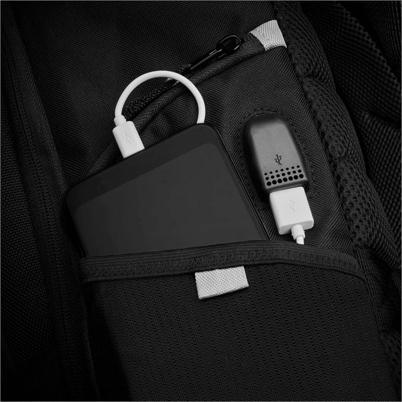 Internal view of backpack showing USB charging port and cable organization