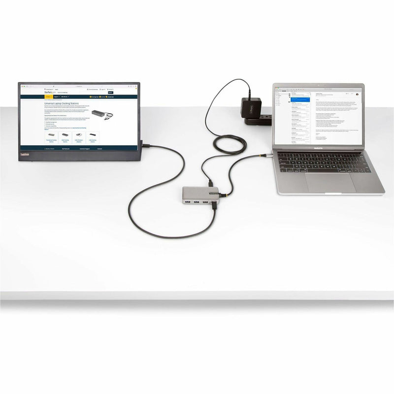 USB-C hub connected to laptop and external monitor in a workspace setup