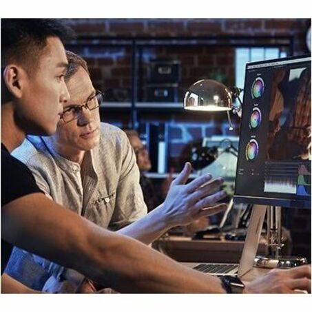 Creative professionals collaborating using ASUS ProArt monitor