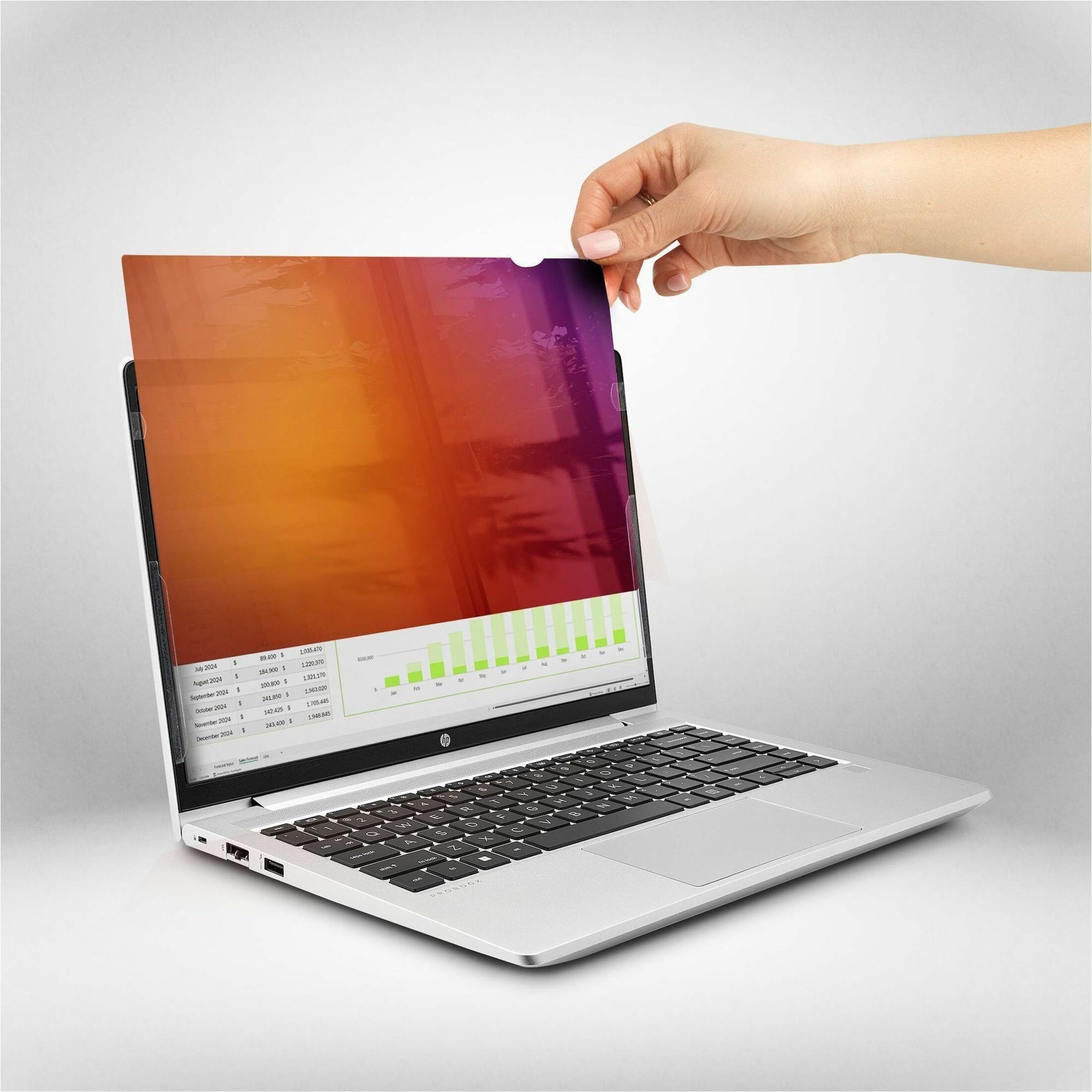 Hand demonstrating easy removal of privacy screen from laptop display-alternate-image4