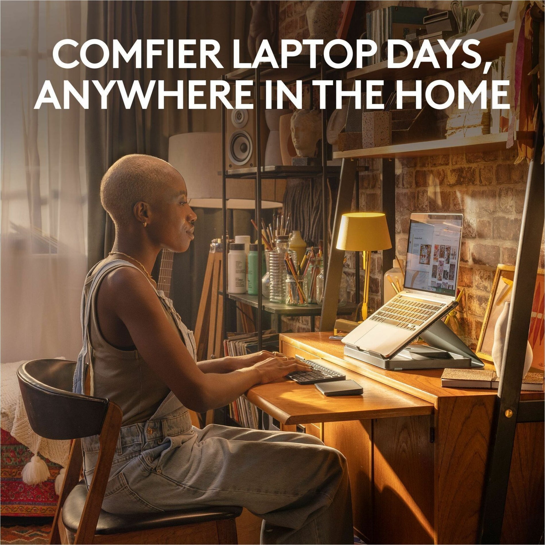 Person working comfortably at home desk with Logitech Casa Pop-Up Kit setup-alternate-image2