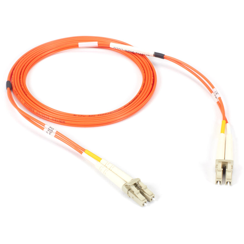 Full length view of orange multimode fiber optic patch cable with LC connectors coiled